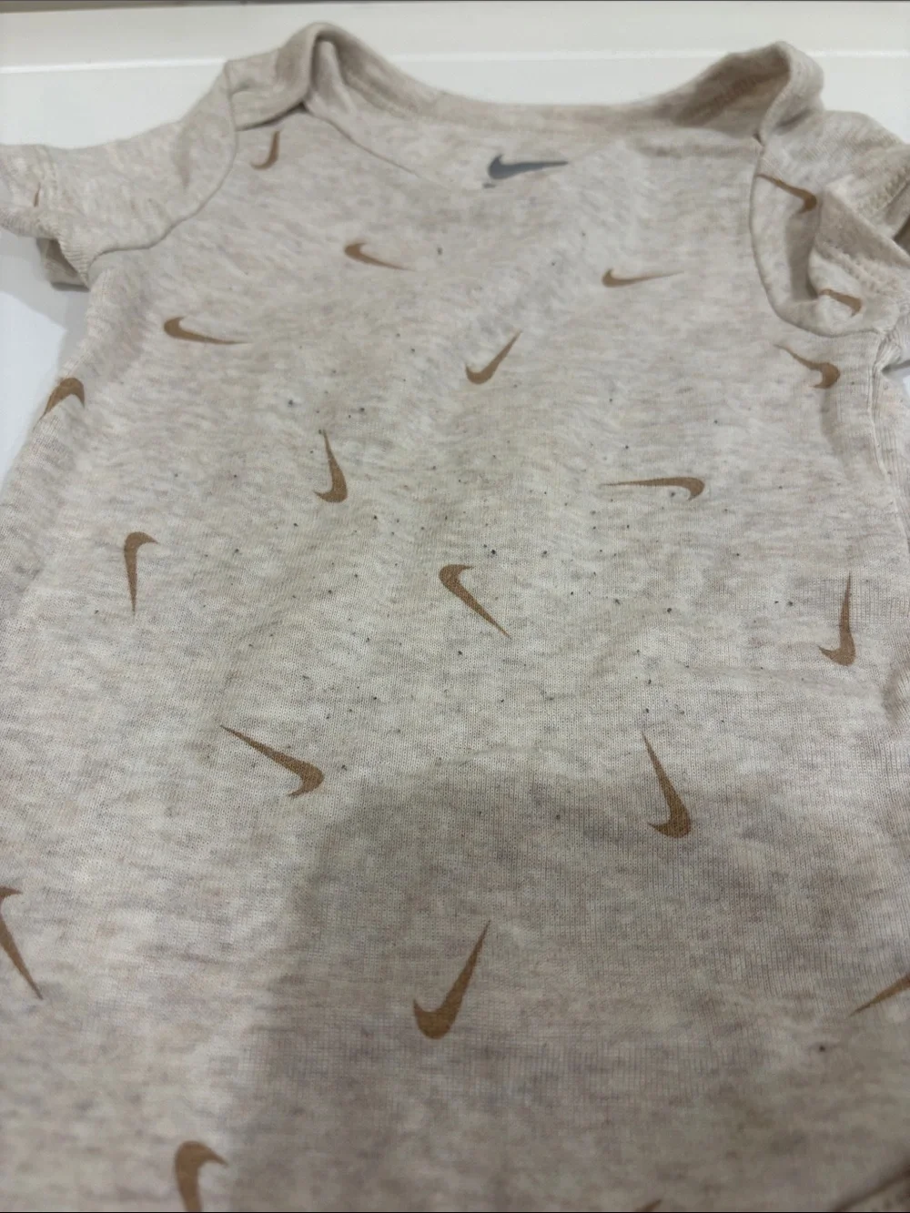 Nike Light Beige Baby One-Piece Bodysuit with Brown Swoosh Print